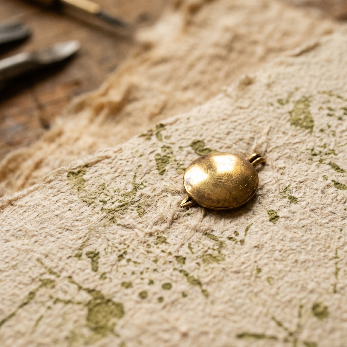 Textured paper detail with brass fastener