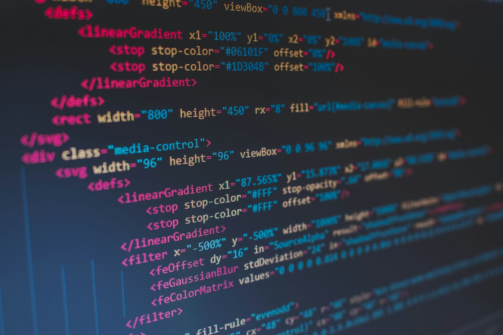 Code on a dark screen — the visual shorthand of modern software work
