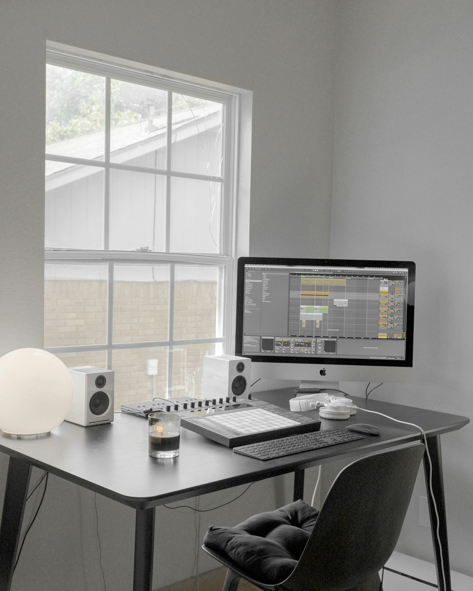 Clean minimal workspace — monitor on a white wood desk