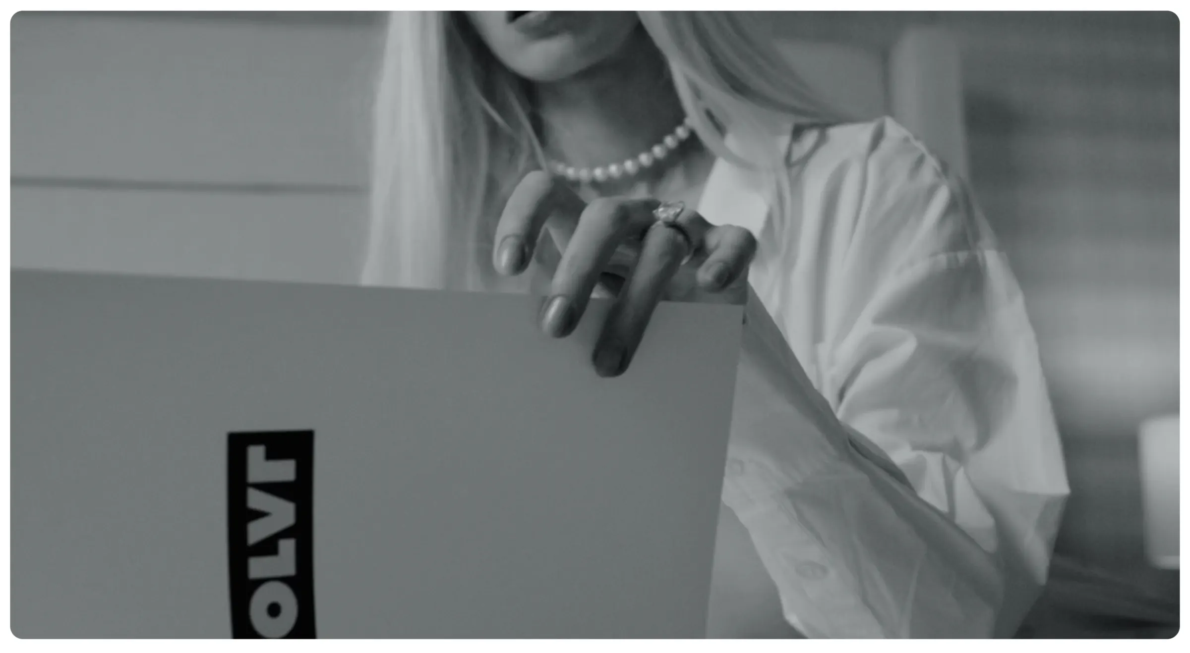 The OLVR box being opened, shot in black and white.