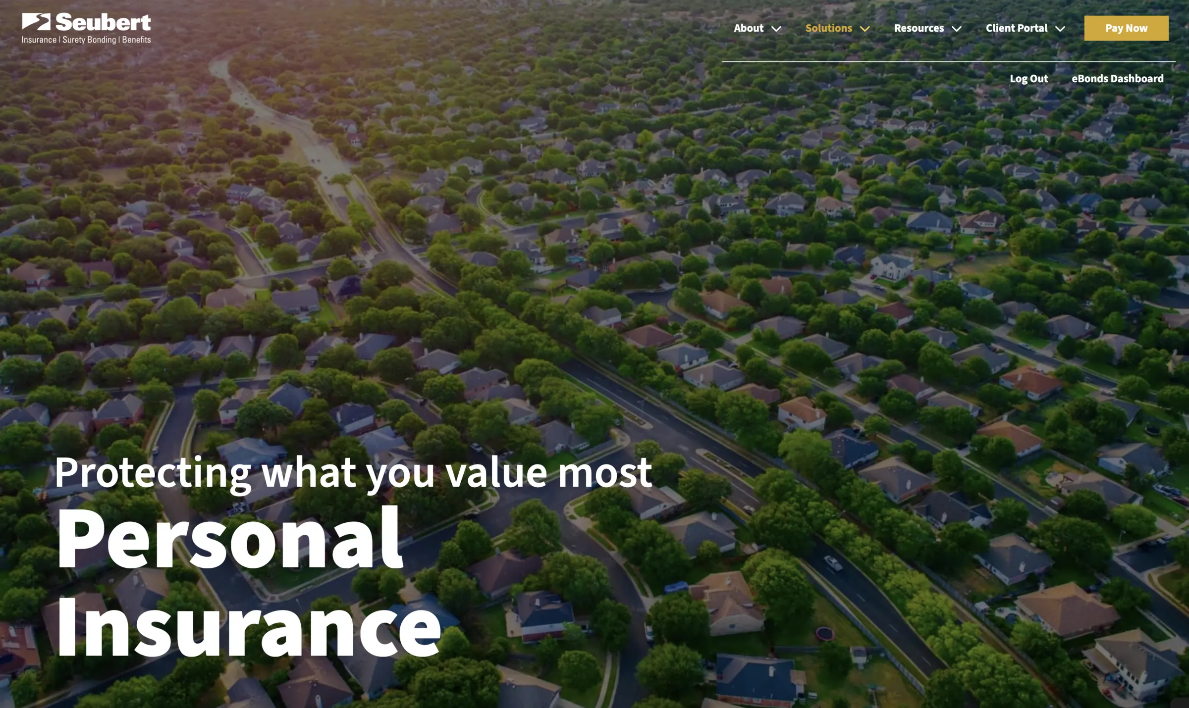 The personal insurance page opening on an aerial of a suburb: “Protecting what you value most.”
