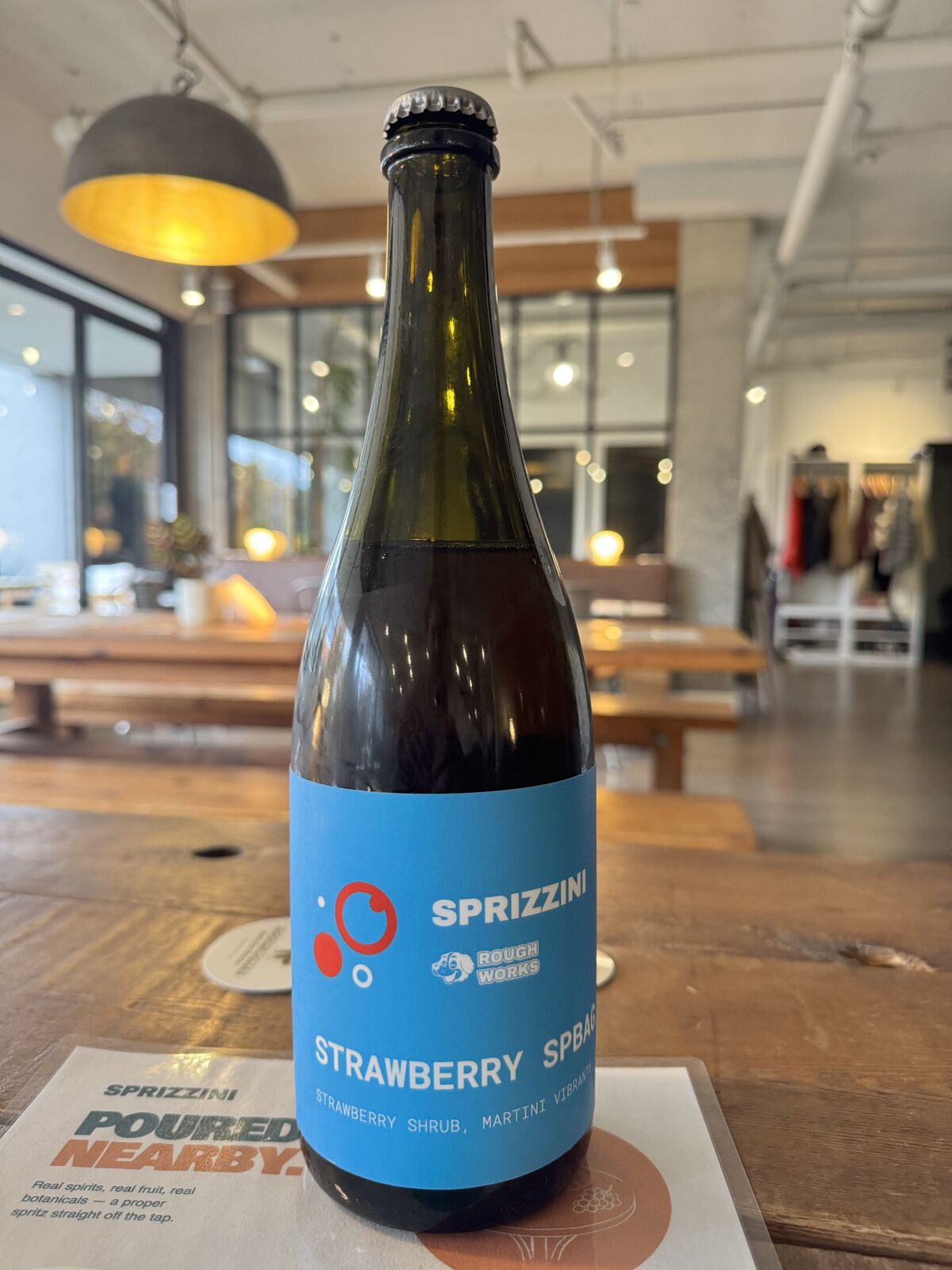 The Strawberry Spritz bottle, sky-blue label